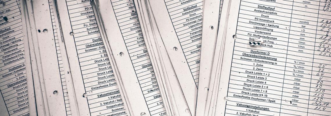 stack of white lists on paper