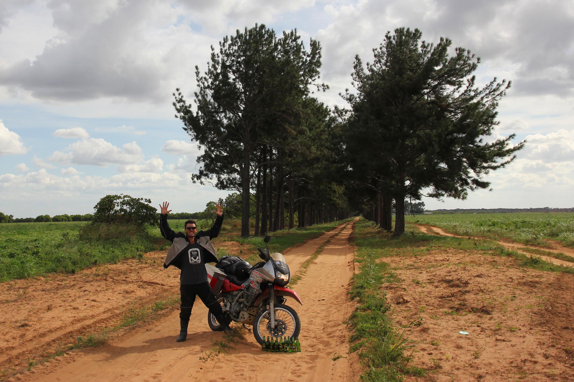 9,000 miles - The road to Ciudad Bolivar, Venezuela -- Moments after resolving a heat-induced spat when our celebratory beers erupted in Aidan's panniers and drenched all our supplies.